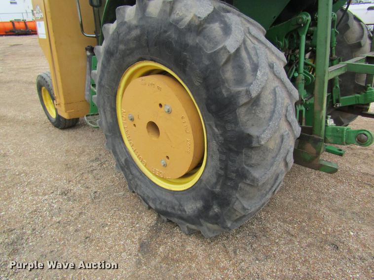 image for item DC4430 2002 John Deere 6420 tractor with side boom mower