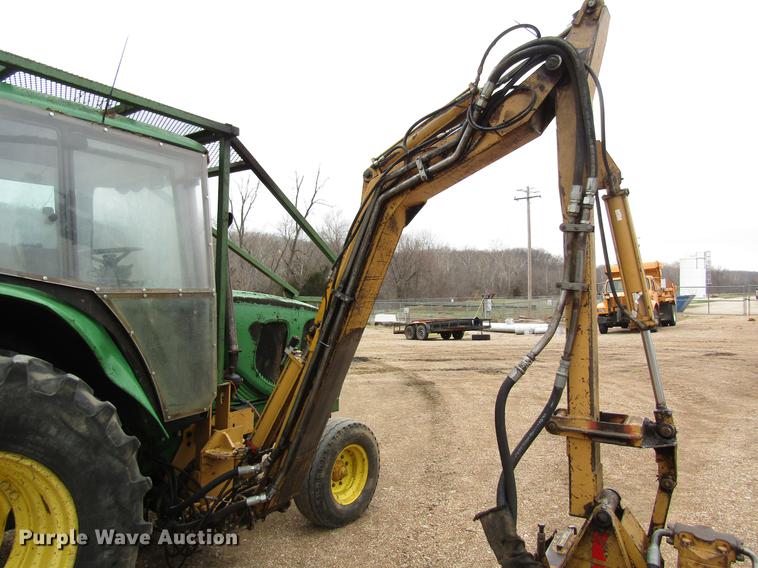 image for item DC4430 2002 John Deere 6420 tractor with side boom mower