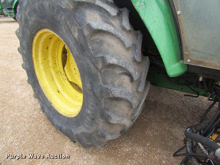 image for item DC4430 2002 John Deere 6420 tractor with side boom mower