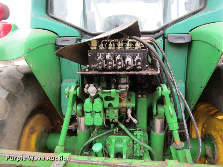 image for item DC4430 2002 John Deere 6420 tractor with side boom mower