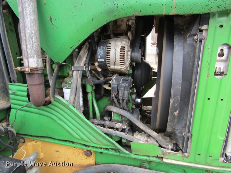image for item DC4430 2002 John Deere 6420 tractor with side boom mower