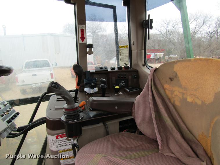 image for item DC4430 2002 John Deere 6420 tractor with side boom mower