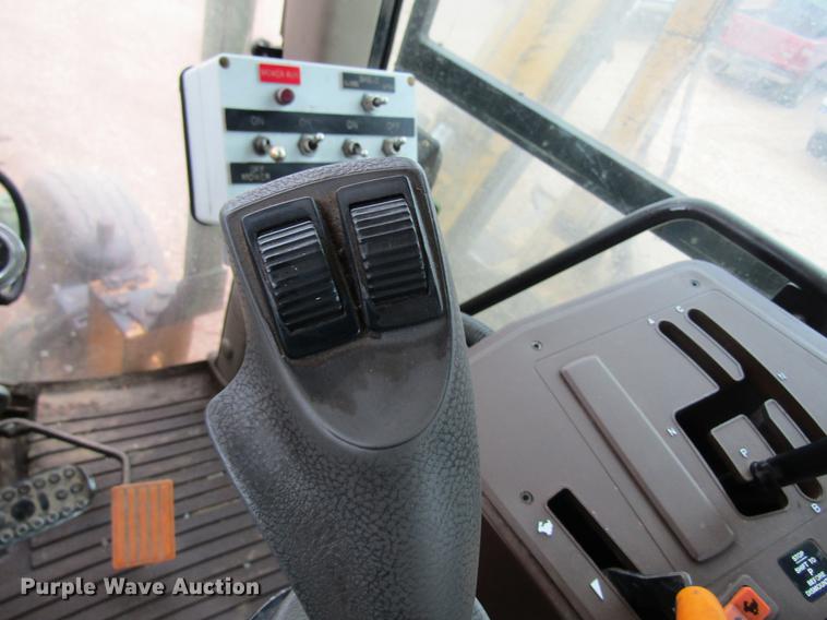 image for item DC4430 2002 John Deere 6420 tractor with side boom mower