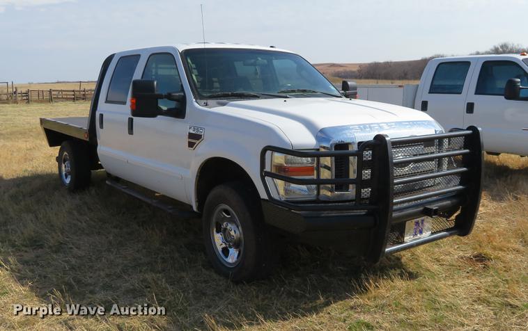 image for item DC0986 2009 Ford F350 Super Duty Crew Cab flatbed pickup truck