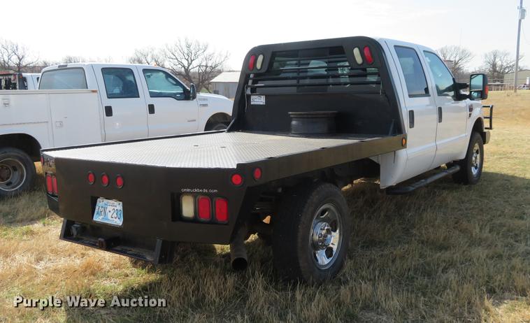 image for item DC0986 2009 Ford F350 Super Duty Crew Cab flatbed pickup truck