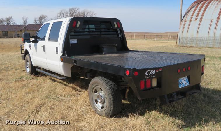 image for item DC0986 2009 Ford F350 Super Duty Crew Cab flatbed pickup truck