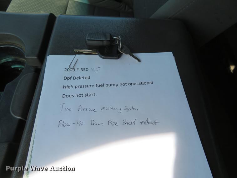 image for item DC0986 2009 Ford F350 Super Duty Crew Cab flatbed pickup truck