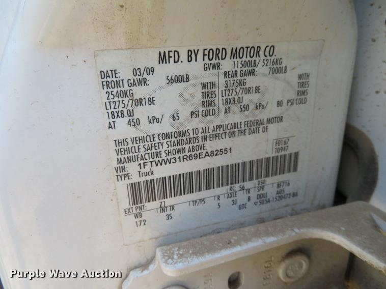 image for item DC0986 2009 Ford F350 Super Duty Crew Cab flatbed pickup truck