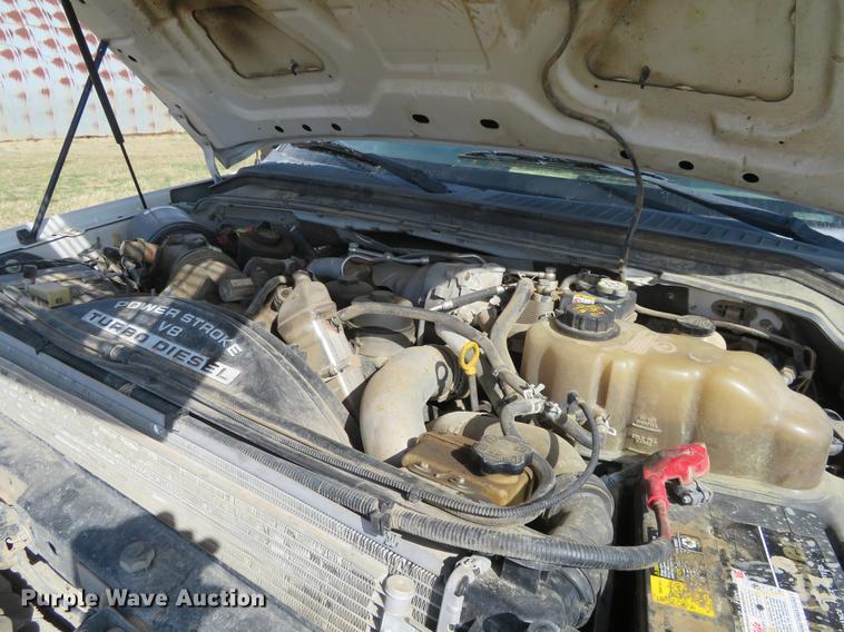 image for item DC0986 2009 Ford F350 Super Duty Crew Cab flatbed pickup truck