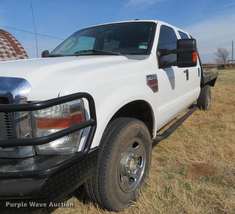 image for item DC0986 2009 Ford F350 Super Duty Crew Cab flatbed pickup truck