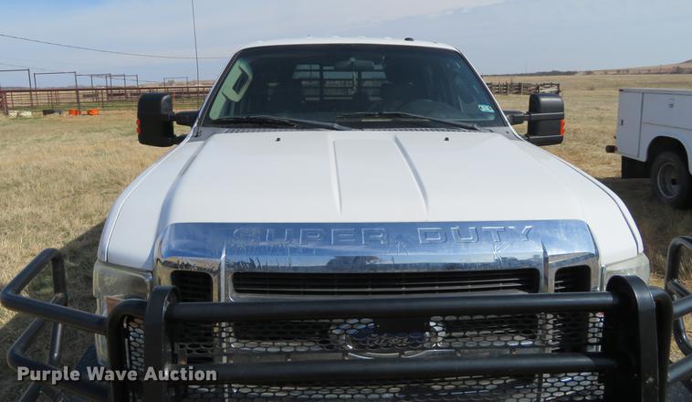 image for item DC0986 2009 Ford F350 Super Duty Crew Cab flatbed pickup truck