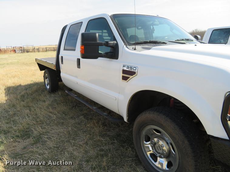 image for item DC0986 2009 Ford F350 Super Duty Crew Cab flatbed pickup truck