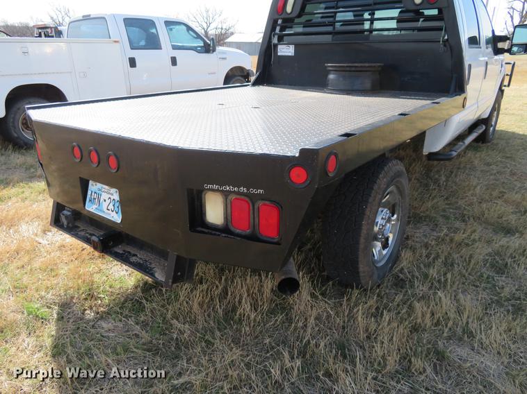 image for item DC0986 2009 Ford F350 Super Duty Crew Cab flatbed pickup truck