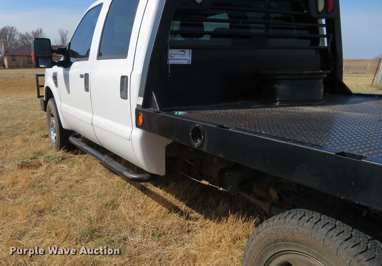 image for item DC0986 2009 Ford F350 Super Duty Crew Cab flatbed pickup truck