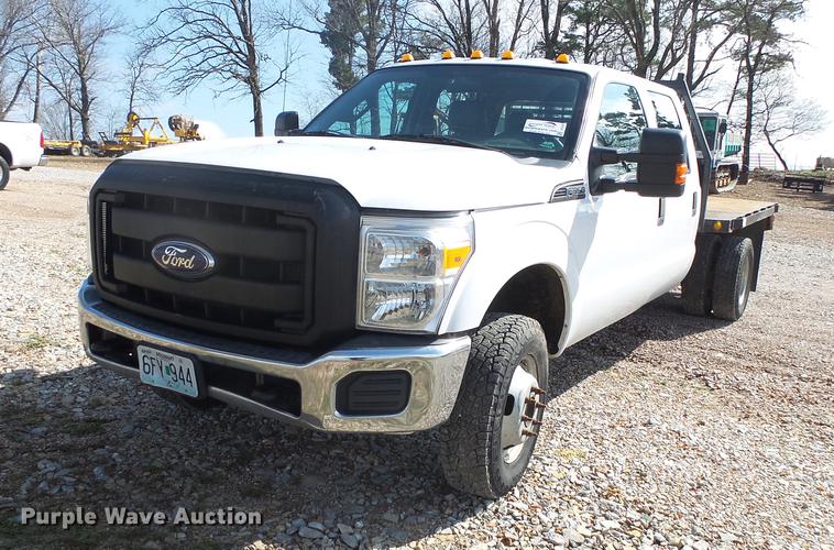 image for item DE3595 2012 Ford F350 Super Duty Crew Cab flatbed pickup truck