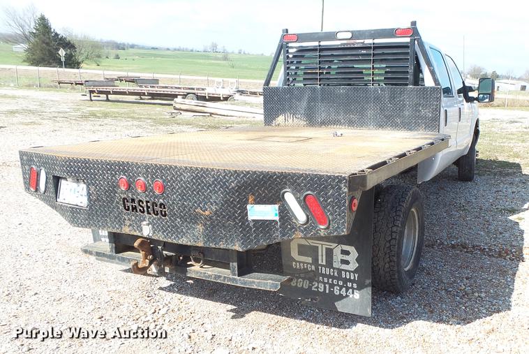 image for item DE3595 2012 Ford F350 Super Duty Crew Cab flatbed pickup truck