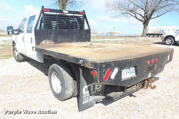 image for item DE3595 2012 Ford F350 Super Duty Crew Cab flatbed pickup truck