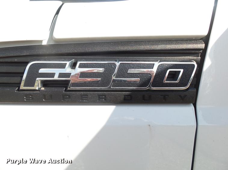 image for item DE3595 2012 Ford F350 Super Duty Crew Cab flatbed pickup truck
