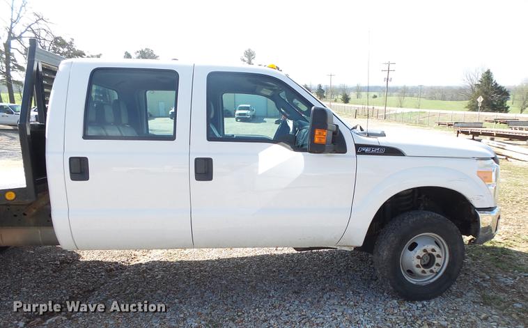 image for item DE3595 2012 Ford F350 Super Duty Crew Cab flatbed pickup truck