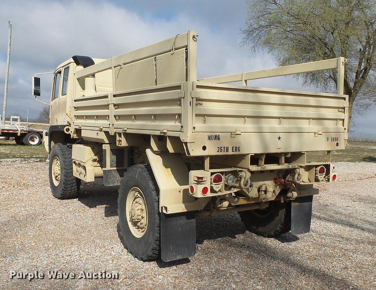 image for item DE3596 1997 Stewart Stevenson M-1078 flatbed truck