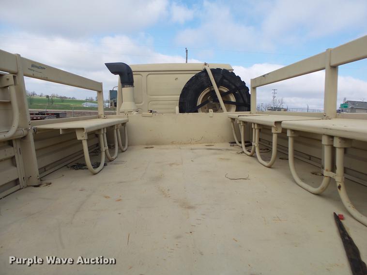 image for item DE3596 1997 Stewart Stevenson M-1078 flatbed truck