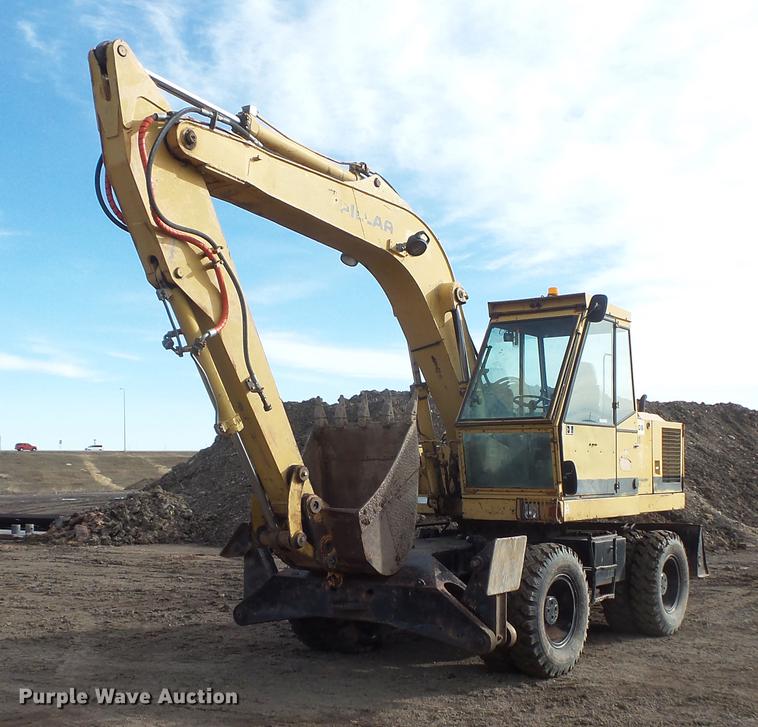 image for item DV9673 1985 Caterpillar 206 rubber tire excavator