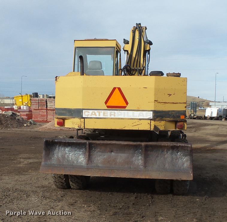 image for item DV9673 1985 Caterpillar 206 rubber tire excavator