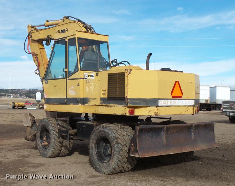 image for item DV9673 1985 Caterpillar 206 rubber tire excavator