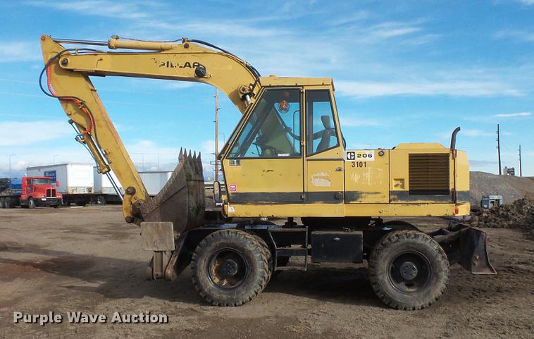 image for item DV9673 1985 Caterpillar 206 rubber tire excavator