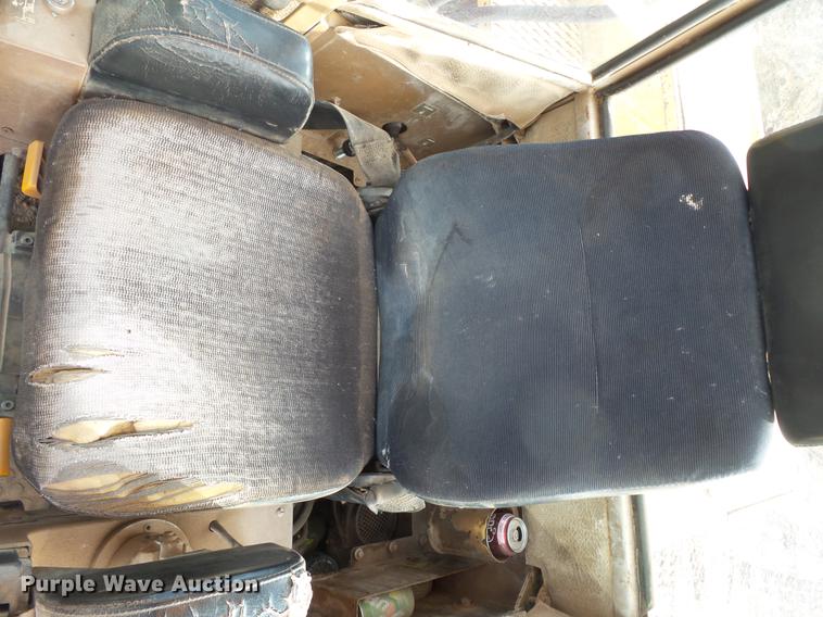 image for item DV9673 1985 Caterpillar 206 rubber tire excavator