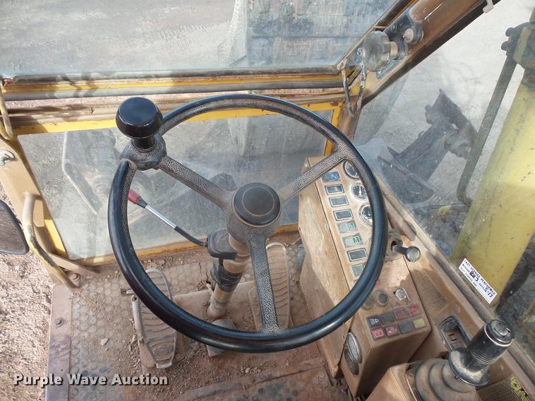 image for item DV9673 1985 Caterpillar 206 rubber tire excavator