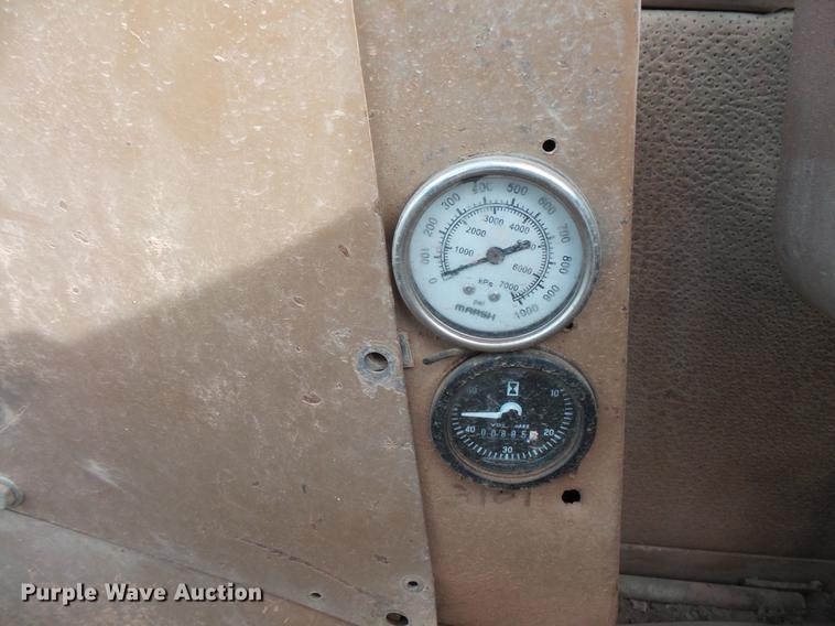 image for item DV9673 1985 Caterpillar 206 rubber tire excavator