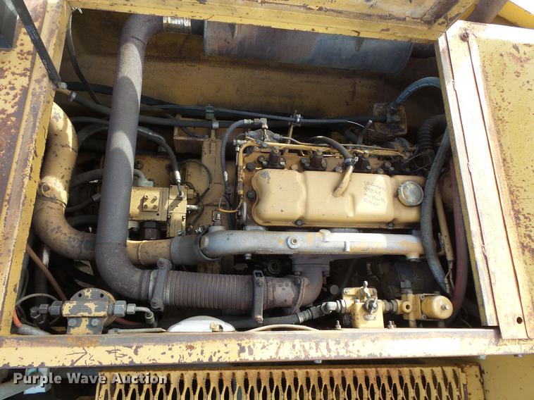 image for item DV9673 1985 Caterpillar 206 rubber tire excavator