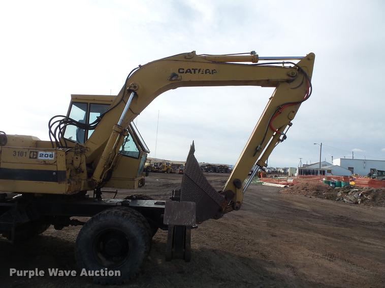 image for item DV9673 1985 Caterpillar 206 rubber tire excavator