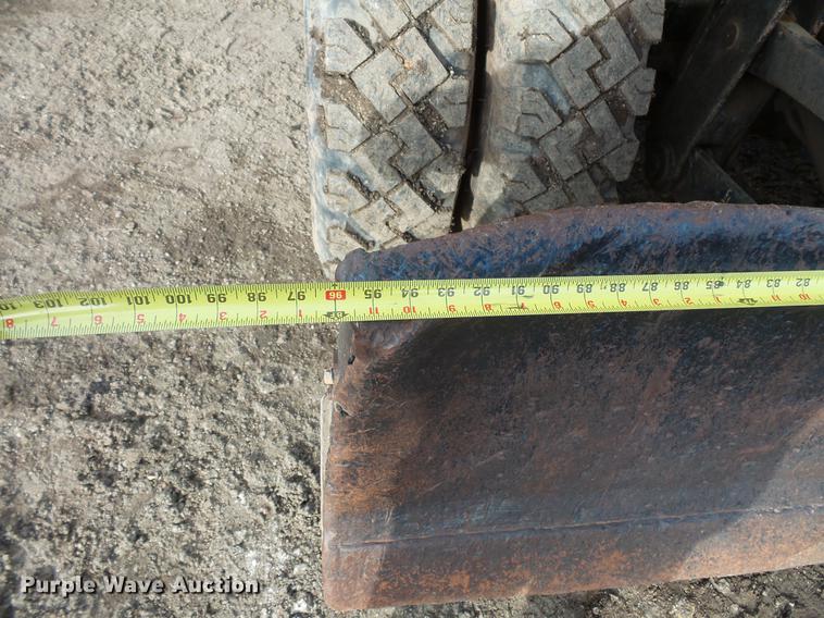 image for item DV9673 1985 Caterpillar 206 rubber tire excavator