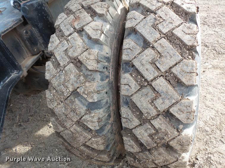 image for item DV9673 1985 Caterpillar 206 rubber tire excavator