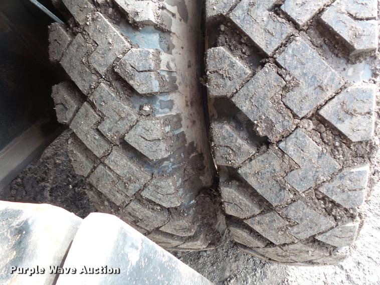 image for item DV9673 1985 Caterpillar 206 rubber tire excavator