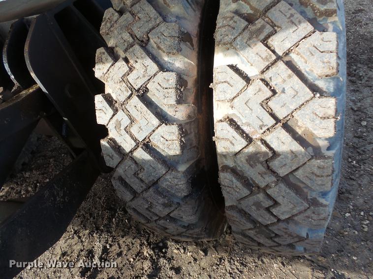 image for item DV9673 1985 Caterpillar 206 rubber tire excavator