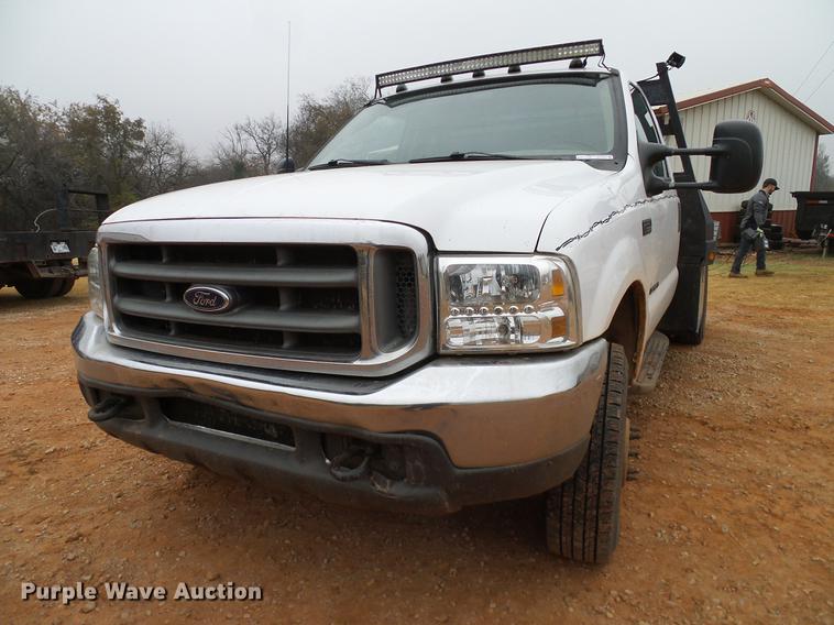 image for item AO9372 2000 Ford F350 Super Duty flatbed pickup truck