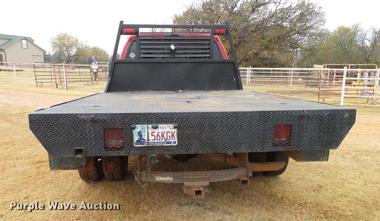 image for item AO9378 1999 Ford F350 Super Duty SuperCab flatbed pickup truck