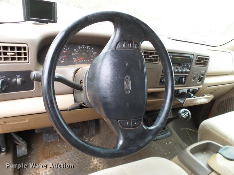 image for item AO9378 1999 Ford F350 Super Duty SuperCab flatbed pickup truck