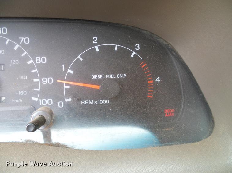 image for item AO9378 1999 Ford F350 Super Duty SuperCab flatbed pickup truck