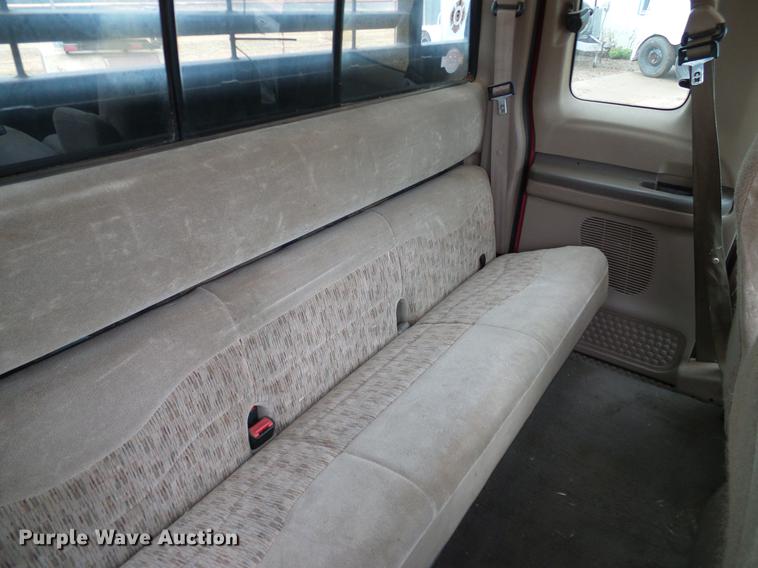 image for item AO9378 1999 Ford F350 Super Duty SuperCab flatbed pickup truck