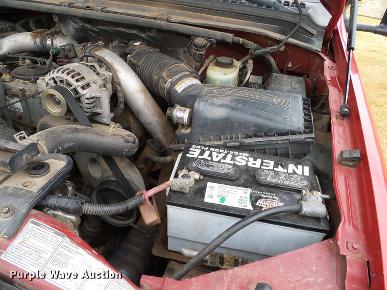 image for item AO9378 1999 Ford F350 Super Duty SuperCab flatbed pickup truck