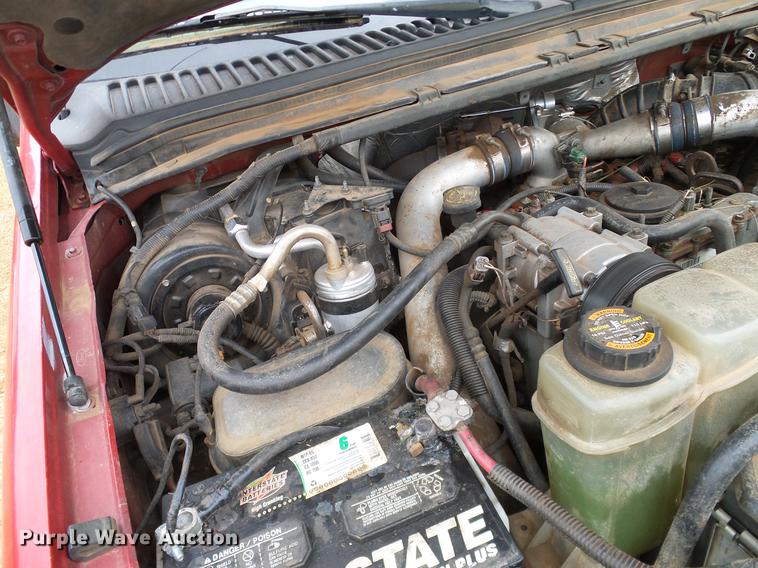 image for item AO9378 1999 Ford F350 Super Duty SuperCab flatbed pickup truck