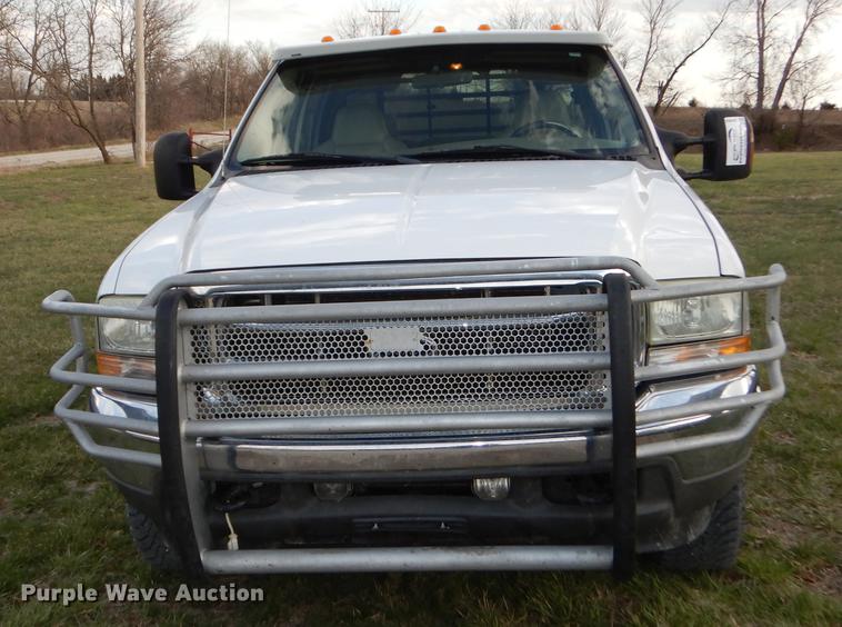 image for item DC0424 2004 Ford F350 Super Duy Lariat Crew Cab flatbed pickup truck