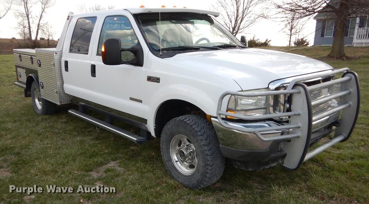 image for item DC0424 2004 Ford F350 Super Duy Lariat Crew Cab flatbed pickup truck