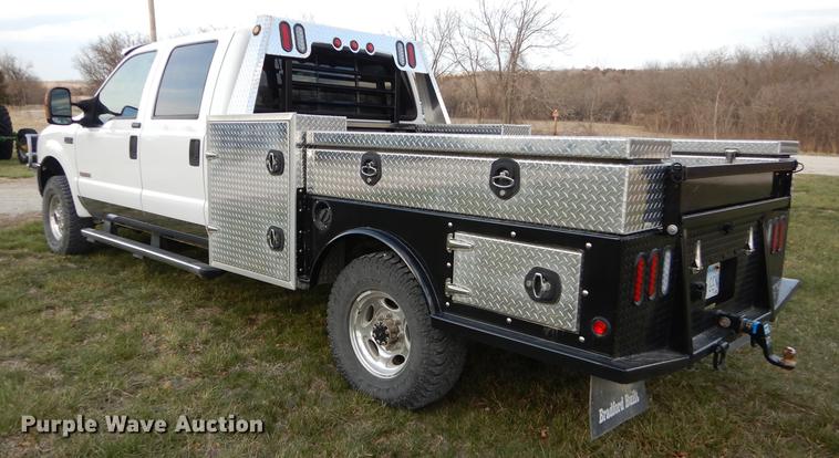 image for item DC0424 2004 Ford F350 Super Duy Lariat Crew Cab flatbed pickup truck