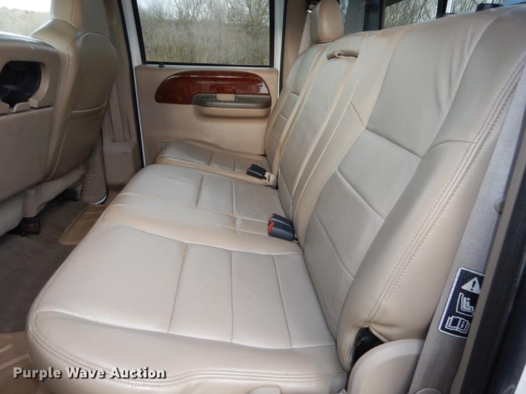 image for item DC0424 2004 Ford F350 Super Duy Lariat Crew Cab flatbed pickup truck