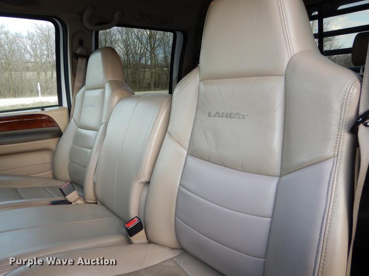 image for item DC0424 2004 Ford F350 Super Duy Lariat Crew Cab flatbed pickup truck